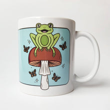 Load image into Gallery viewer, Cheerful Frog with Brown Mushrooms and Butterflies | Mushroom Pals | Ceramic Mug - Scaredy Cat Studio
