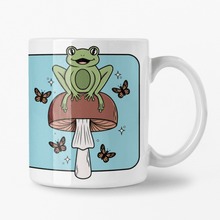 Load image into Gallery viewer, Cheerful Frog with Brown Mushrooms and Butterflies | Mushroom Pals | Ceramic Mug - Scaredy Cat Studio
